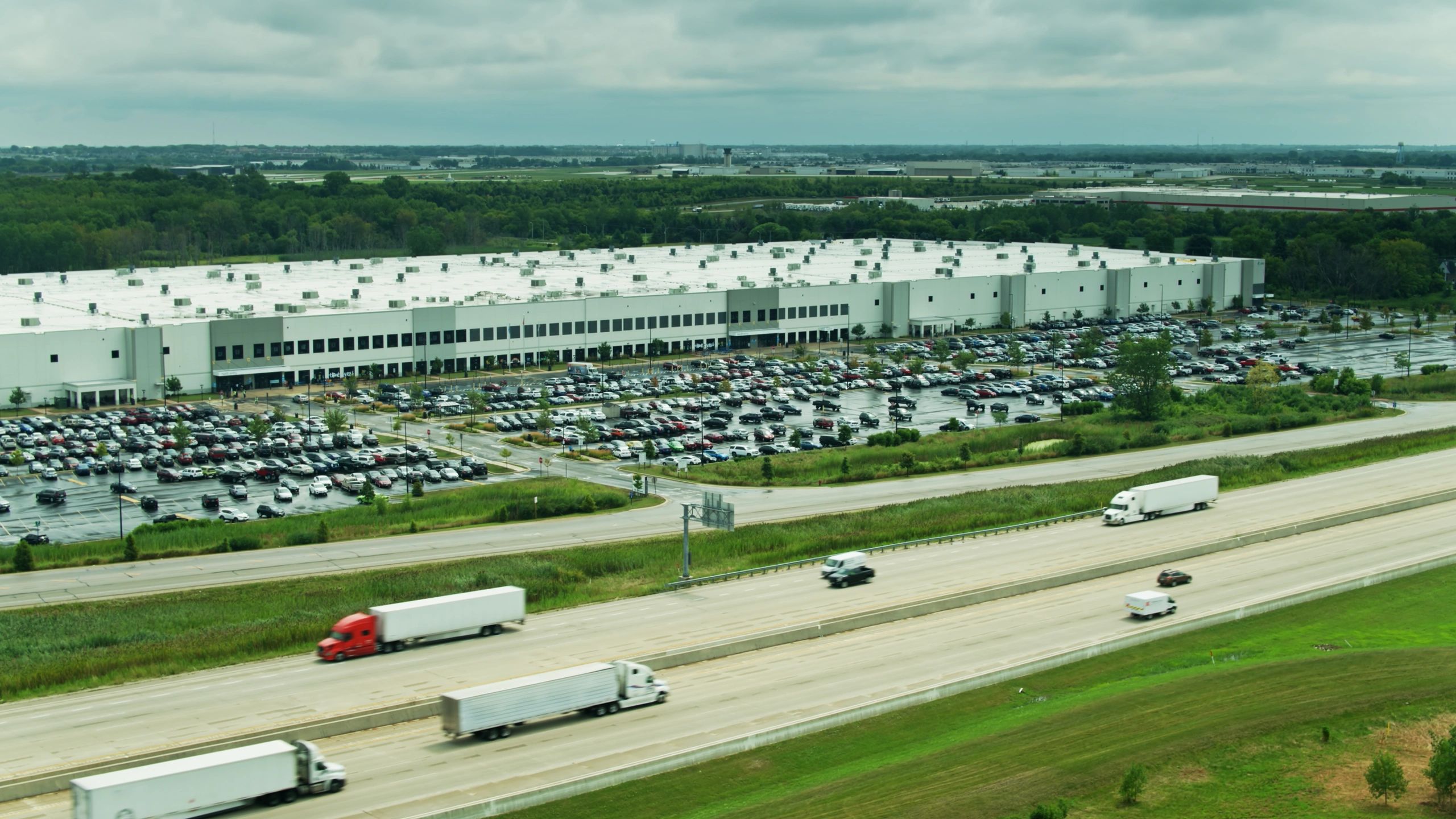 Aerial view of a distribution center near a freeway
