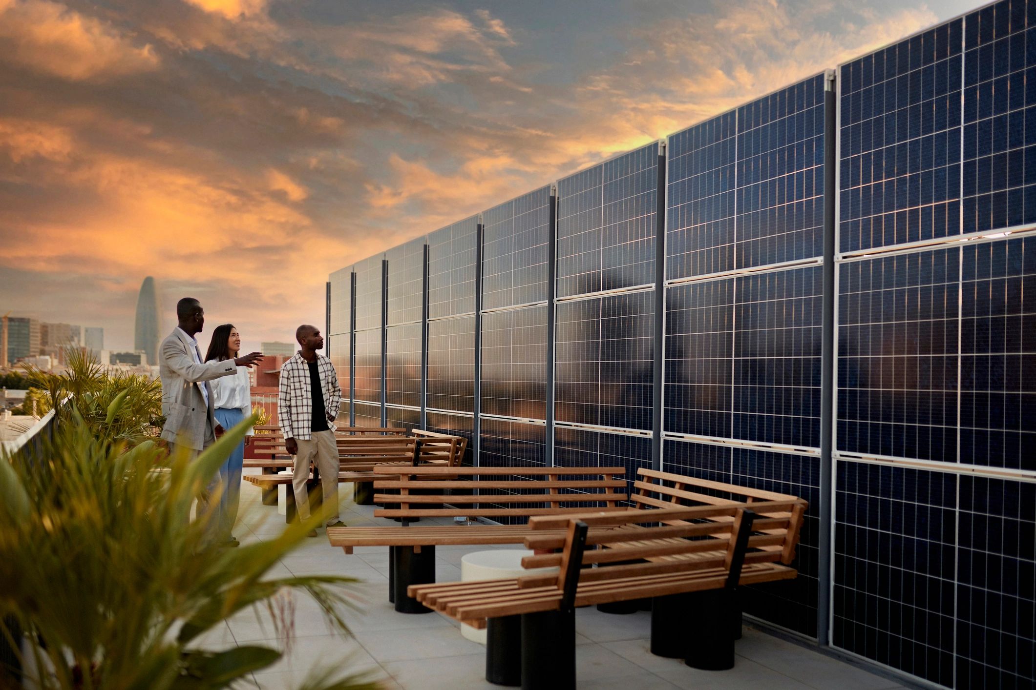 Team on a rooftop reviewing a solar energy system